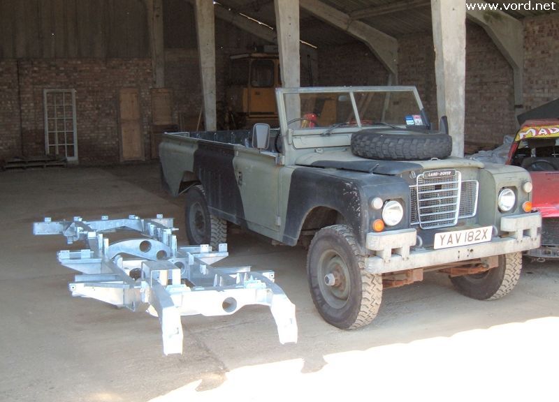 Here's Chris's Land Rover in the barn beside the brand new chassis The old
