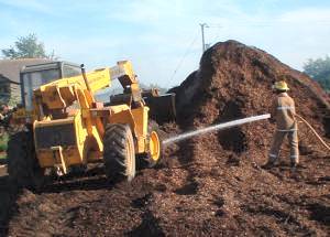 Loadall used to spread wood chippings