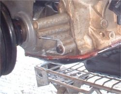Cut out in timing cover to clear steering rack
