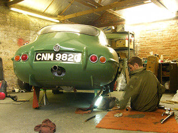 Rear axle being refitted