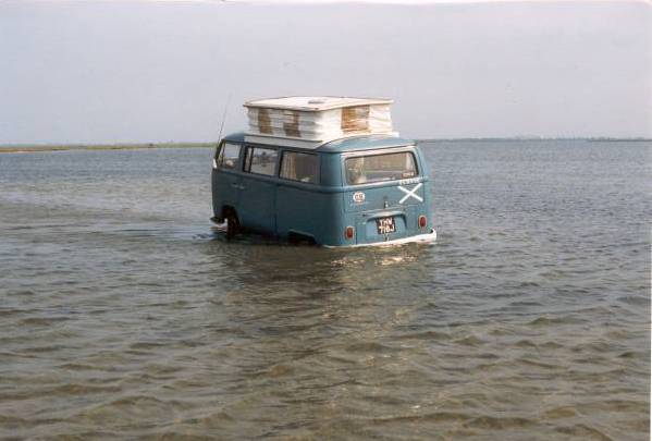 bus listing in the water