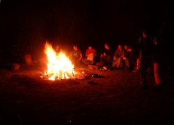 Group illuminated by bonfire