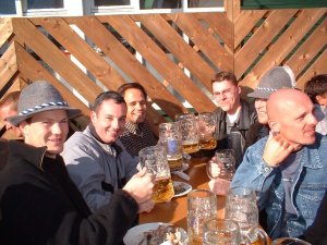 Drinking beer on outside table in sunshine