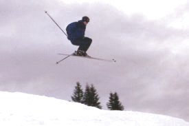 John jumping very high on skis