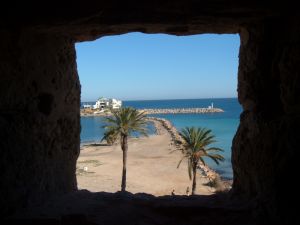 Palm trees through a window in the ribat